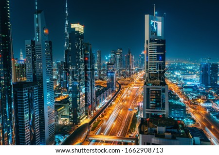 Panorama of Dubai downtown at night from above, United Arab Emirates. Royalty-Free Stock Photo #1662908713