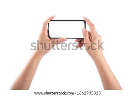 Smartphone in female hands taking photo isolated on white blackground Royalty-Free Stock Photo #1662935323