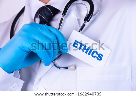 Doctor holding a card with text Ethics medical concept Royalty-Free Stock Photo #1662940735