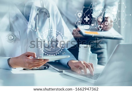 Double exposure of healthcare And Medicine concept. Doctor hands using tablet and modern virtual screen interface.