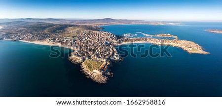 Aerial view of Sozopol town on black sea coast, summer holyday destination with white sand and clear blue water. Historic old town with old buildings. 