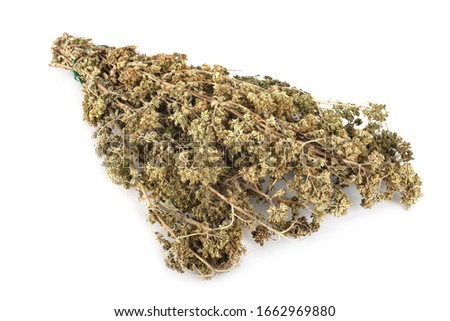 dried origano in front of white background