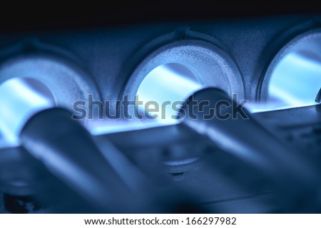 Closeup Shot Of Home Furnace Burner Ignited Royalty-Free Stock Photo #166297982