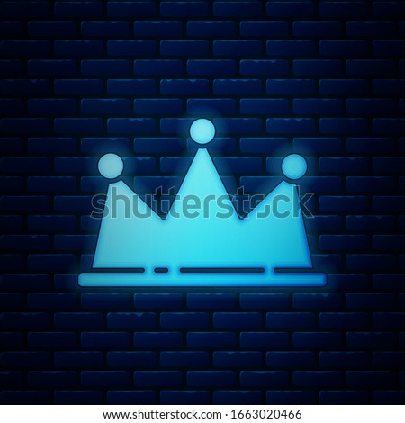 Glowing neon Crown icon isolated on brick wall background.  Vector Illustration