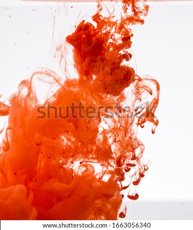Acrylic red colors in water. Abstract background. Abstract paints.