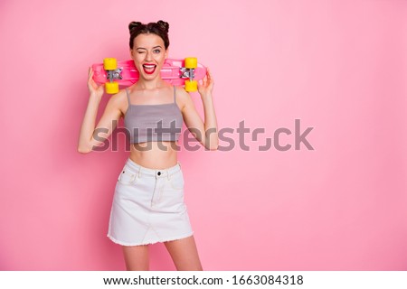Portrait of lovely cool youngster girl sport lover have fun summer weekends hold skateboard scream feel rejoice emotions wear casual style clothes isolated over pastel color background