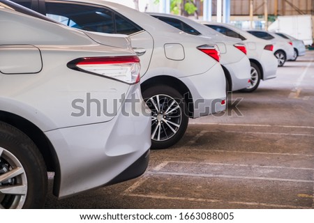 A lot of cars in a row. Сar sales In the parking lot Silver color Car rental service Royalty-Free Stock Photo #1663088005