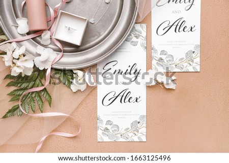 Beautiful composition with wedding invitations, jewelry and cosmetics on color background