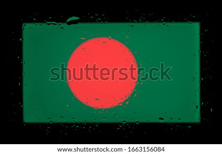 National Flag of Bangladesh. Abstract photo with water drops on glass.