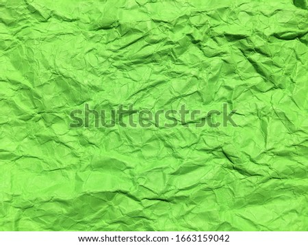 Minimal green crumpled paper texture background for Design. Copy space for text or work 
