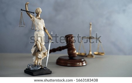 Themis. Law and Jusitce concept photo, silver stone background