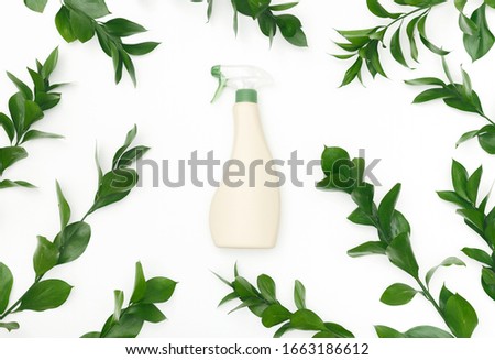 Bio spray bottle with leaves and natural components, Spray for eco friendly natural cleaning, white background