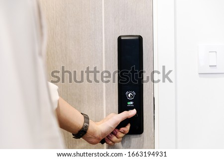 Hand open door on digital knob door.