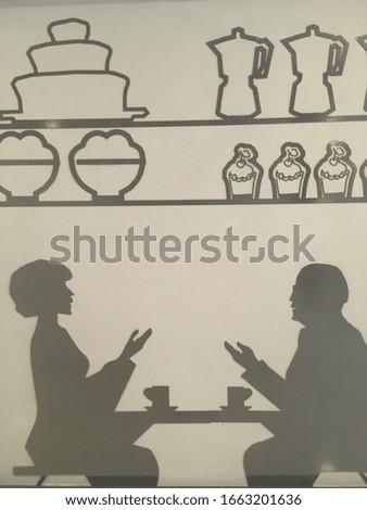 Silhouettes of male and female figures