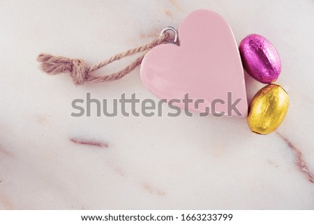 Easter background with colorful eggs on texture marble. Love easter