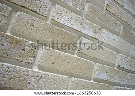 Close-up of the wall surface (light background for photography, texture) in an art studio.