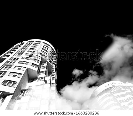 Sky and clouds reflection in skyscrappers. Building from below. Blsck and white concept