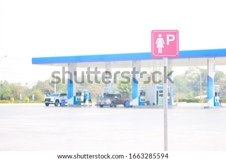 women parking sign in gas station background, Human right, Women's rights. lady first background.