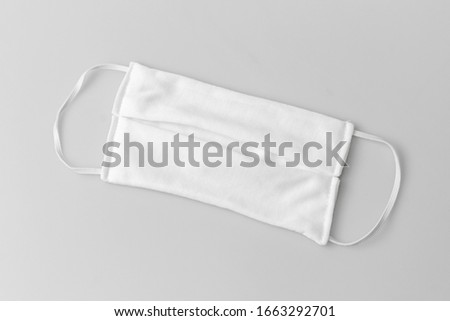 White Thick Cotton Cloth Mask Three Layer on a white background , Mask Cheap price 