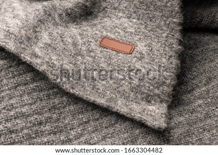 Leather clothing tag, label blank mockup template, to place your design on a knitted scarf