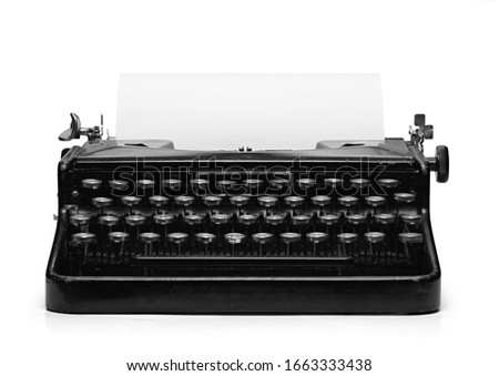 Old vintage typewriter and a blank sheet of paper inserted. Isolated on white background with clipping path Royalty-Free Stock Photo #1663333438