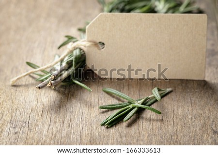 fresh rosemary bunch, on wooden table