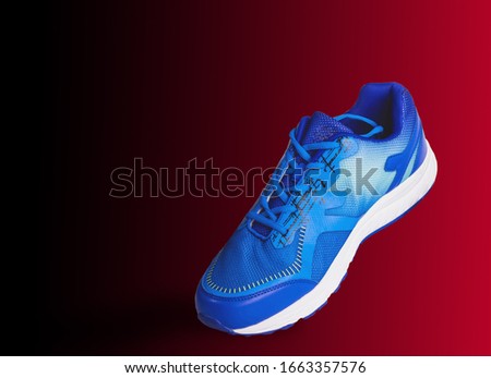 Sports shoes blue for health That separates from the shiny red background clipping part