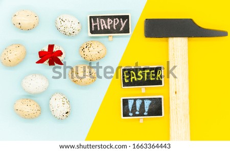 Happy easter creative card. Pop art style. Blue and yellow background. Nine eggs on one side. Hammer on right side. Close up. 