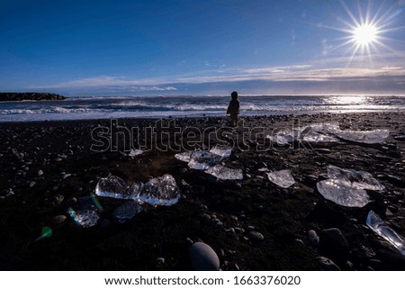 People at Diamond Beach in Iceland.