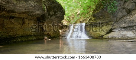 Beautiful waterfall at Canyon Mishoko. Nature and travel. Russia, Adygea, Caucasus Mountains