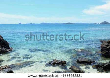 beautiful​ sea​ at​ koh​ kham, chonburi, thailand.​ blue​ sea​ and​ blue​ sky​ and​ rock.