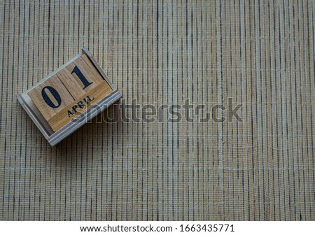1st April blurred wooden calendar , April fool day, concept Royalty-Free Stock Photo #1663435771