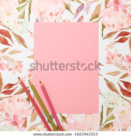 Pink paper and pencils on pastel watercolor flowers background. Invitation, floral, birthday, Mother's, Valentines, Women's, Wedding Day concept.
Overhead top view, flat lay, copy space.
