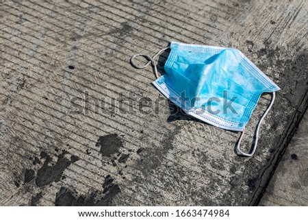 antivirus mask on  floor background. Disposable hygienic mask. Close up of face medical surgery Mask to prevent virus. Royalty-Free Stock Photo #1663474984