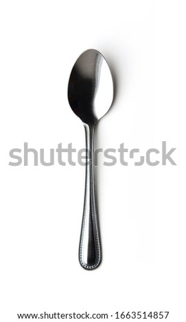 Shiny metal spoon isolated on a white background Royalty-Free Stock Photo #1663514857
