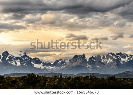 Torres del Paine National Park, is a national park encompassing mountains, glaciers, lakes, and rivers in southern Chilean Patagonia. Photo at sunset.