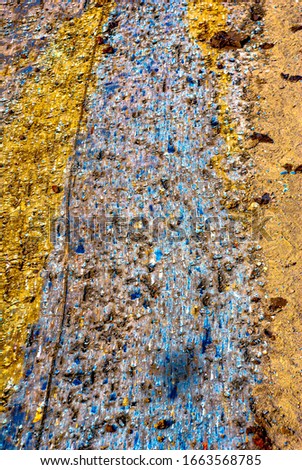 Abstract picture obtained as a result of leveling the soil with a knife of a bulldozer