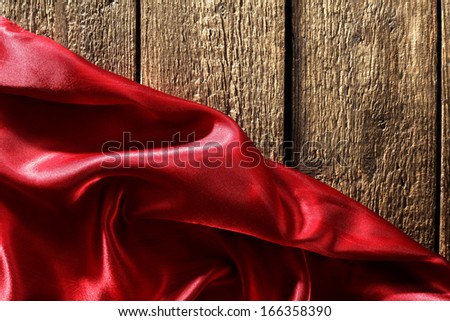 satin of red and empty space of wood 