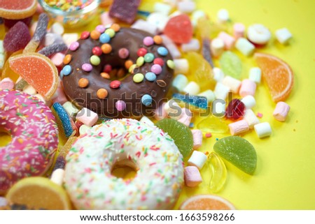 A lot of colorful candy. Tasty appetizing Party Accessories Happy Birthday Sweet Treat Swirl Candy Lollypop on Bright Background Flat Lay