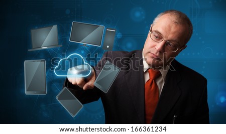Businessman standing and touching high technology cloud service