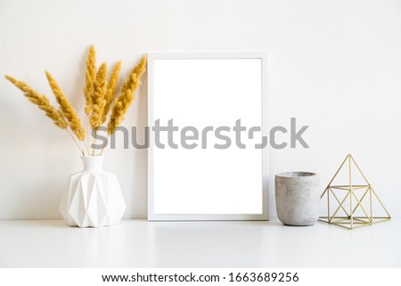 White frame and home decoration details on tabletop with wall, artwork poster mock-up