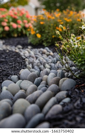 Rock River curving into flowers, summer day Royalty-Free Stock Photo #1663750402