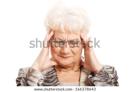 An old elegant lady is having a headache. Isolated on white. 