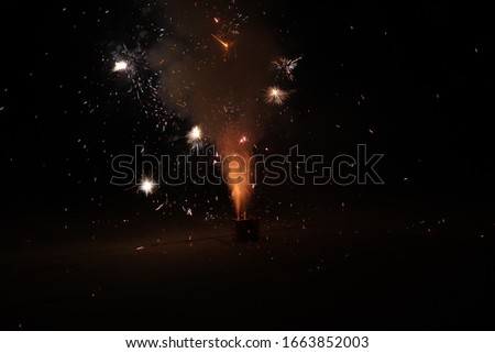 Brightly Colorful Fireworks on night background