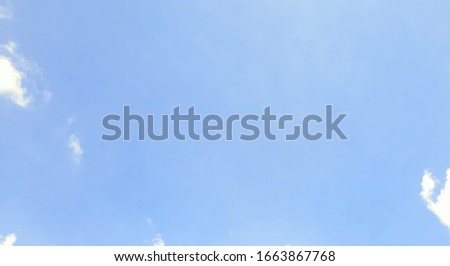 A photograph of the sky at noon  in the day with PM2.5 dust exceeds 50 micrograms, shot from bottom to the sky. The sky background for decorative and design.