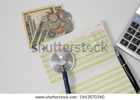 Stethoscope and banknotes with medical insurance concept.