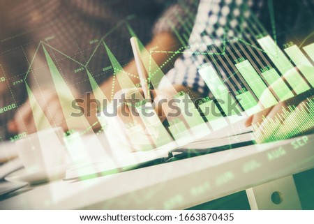 Multi exposure of two men planing investment with stock market forex chart.