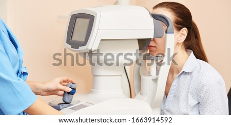 ophthalmologist doctor in exam optician laboratory with female patient. Eye care medical diagnostic. Eyelid treatment Royalty-Free Stock Photo #1663914592