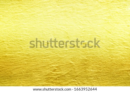 Abstract Golden Stucco Wall Texture Background, Suitable for Backdrop and Mockup.