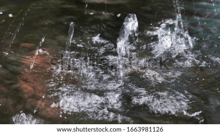 abstract texture pattern of raindrops falling into ponds